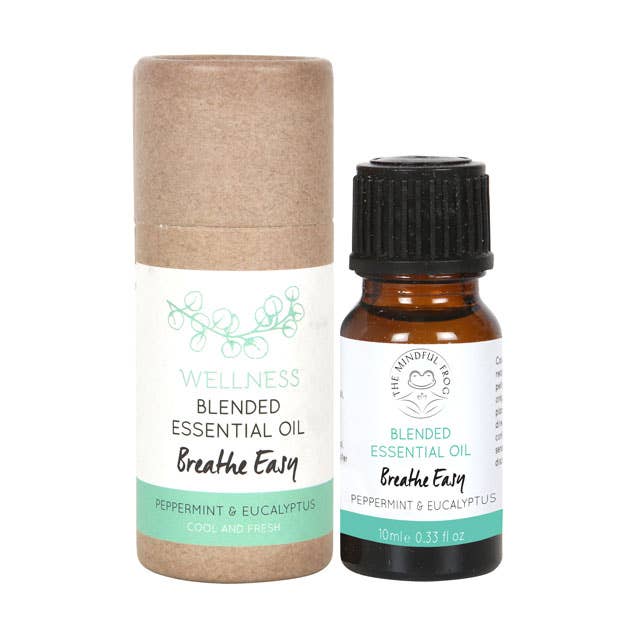 A 10ml bottle of "Breathe Easy" essential oil blend containing Peppermint and Eucalyptus, designed to promote a cool and fresh feeling. The bottle is packaged in a brown cardboard tube.