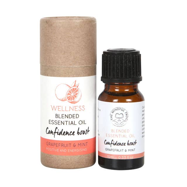 A 10ml bottle of "Confidence Boost" essential oil blend containing Grapefruit and Mint, designed to promote a positive and energizing effect. The bottle is packaged in a brown cardboard tube.