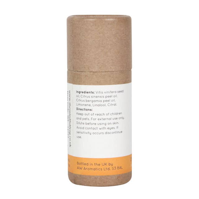 Back of a brown cardboard tube for "Energise Me" essential oil blend by The Mindful Frog. Lists ingredients (Grape Seed Oil, Orange Peel Oil, Bergamot Peel Oil), directions, and contact information.