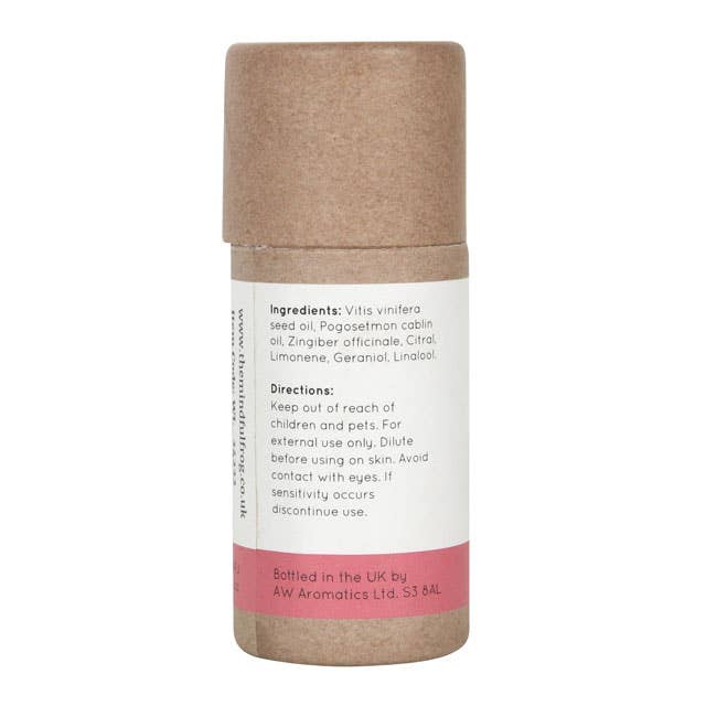 The back of a brown cardboard tube containing the "Balance" essential oil blend by The Mindful Frog. The label lists the ingredients, including Grape Seed Oil, Patchouli Oil, and Ginger Oil. It also includes usage instructions and a warning to keep out of reach of children and pets.