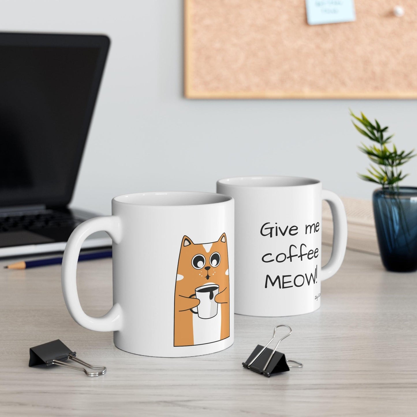 Cat themed coffee mug on a desk