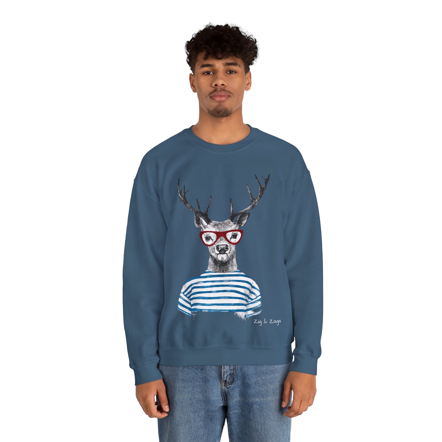 Person wearing a Wild & Free Reindeer unisex sweatshirt in Indigo Blue with quirky stag print on a white background