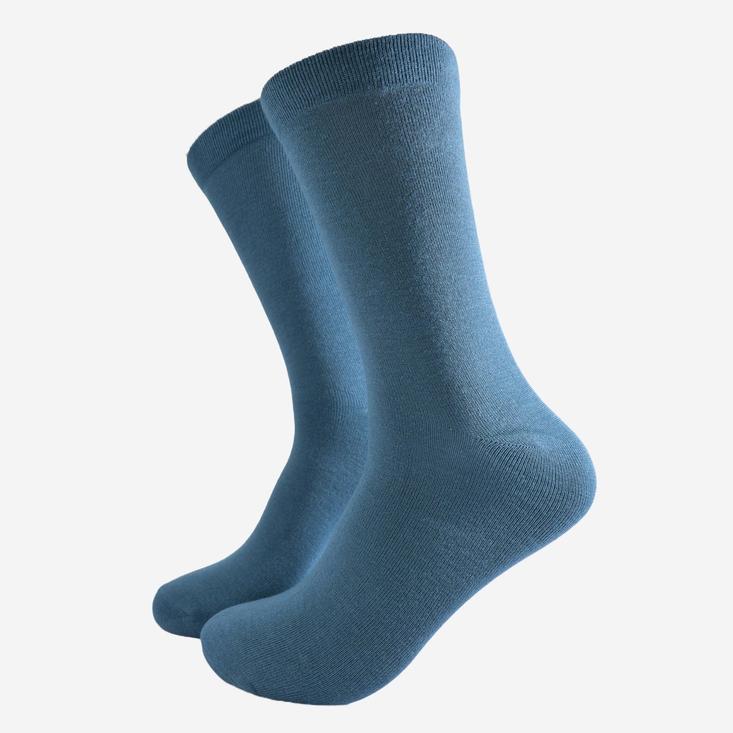 Men’s teal bamboo socks on white background, soft breathable eco-friendly fabric