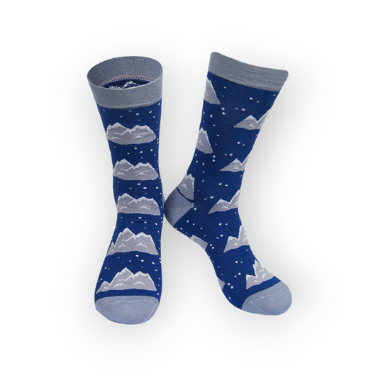 Men's bamboo socks featuring a winter scene with snow-capped mountains and a starry night sky.