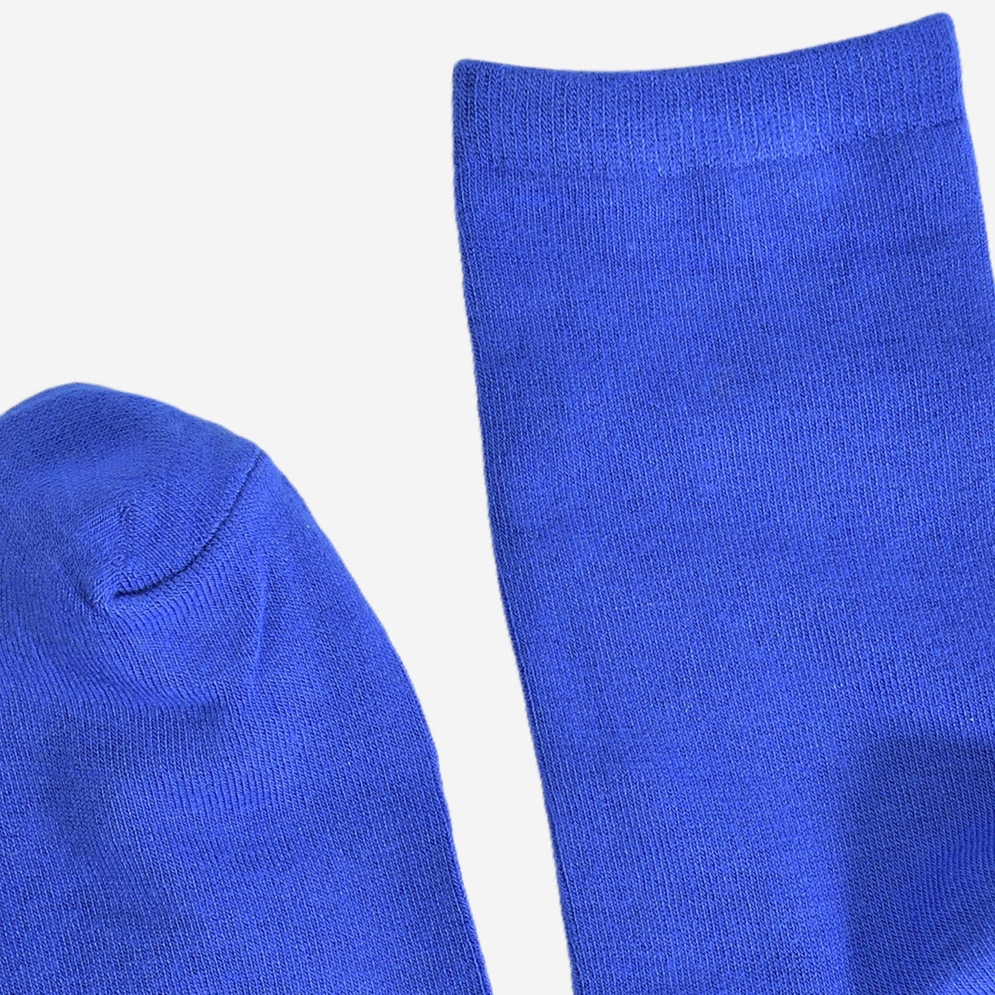 Close up of women’s royal blue bamboo ankle socks displayed flat on a white background.