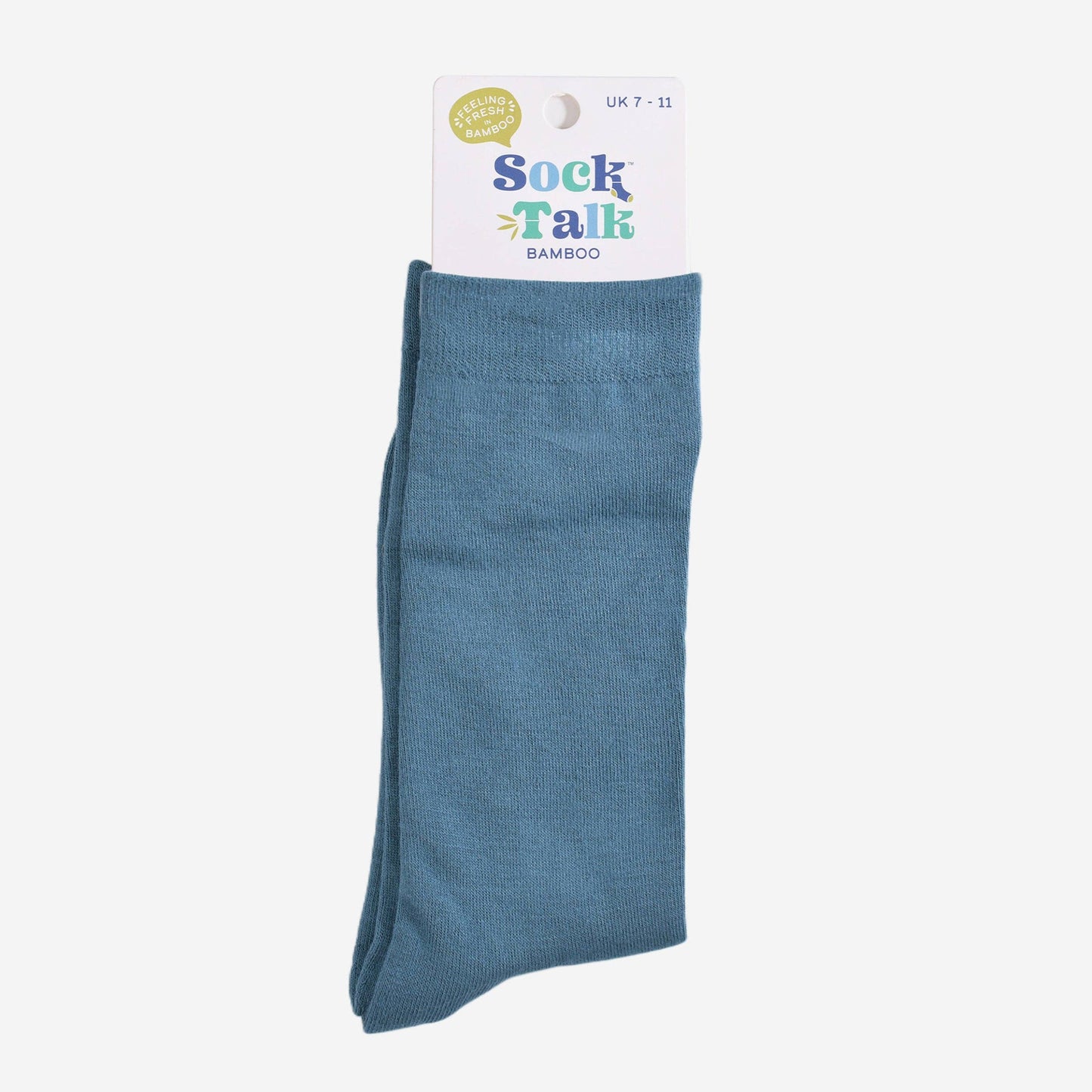 Teal bamboo crew socks folded neatly for product display