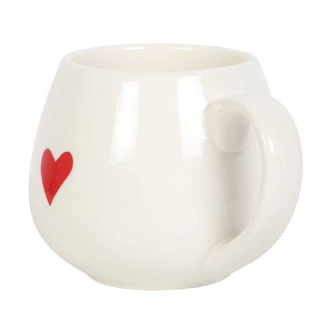 White Ceramic mug with a red heart printed on the front.