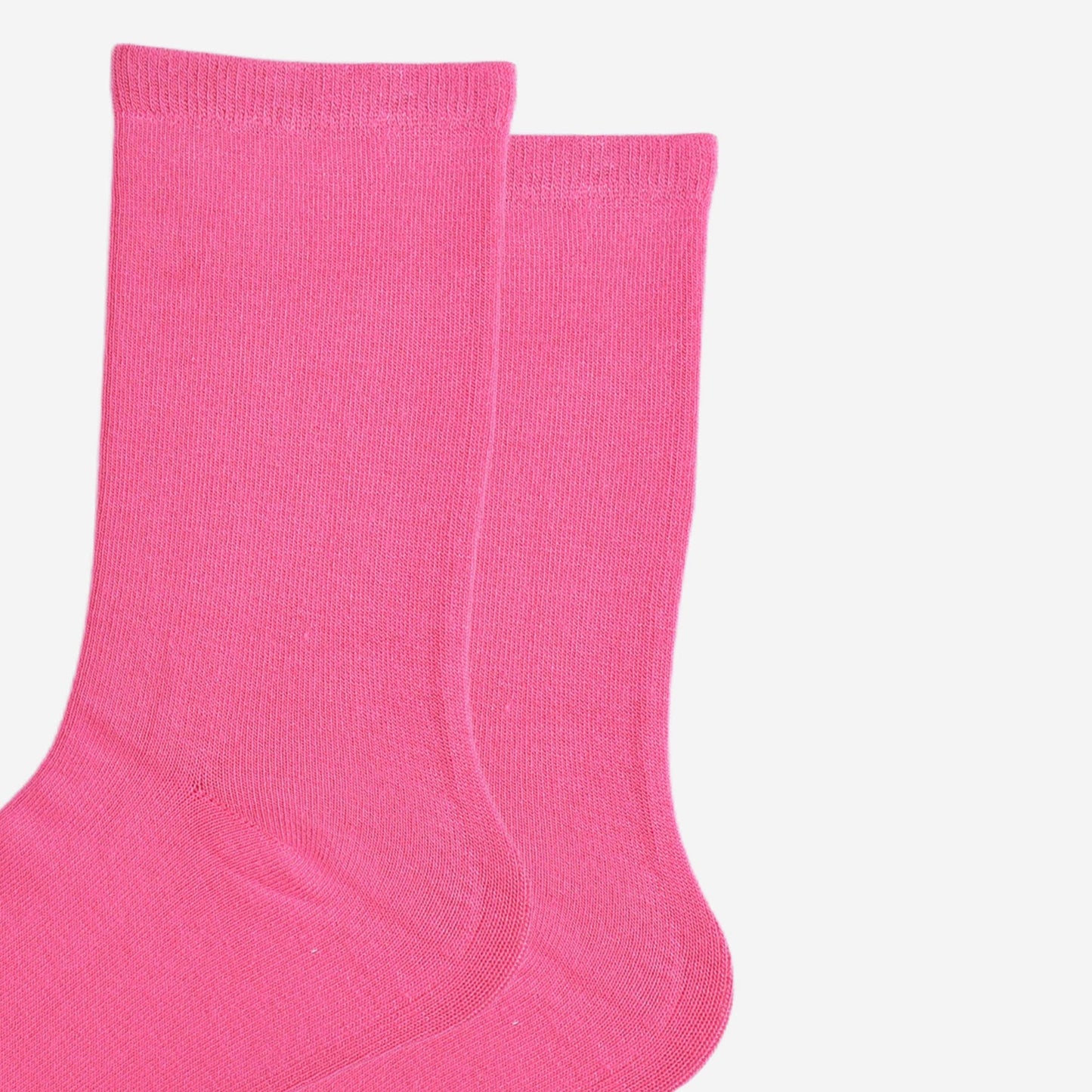 Women’s hot pink bamboo ankle socks cuffs displayed flat on a white background