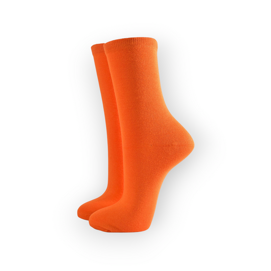 A pair of women's orange bamboo socks, viewed from the side with one foot raised slightly.