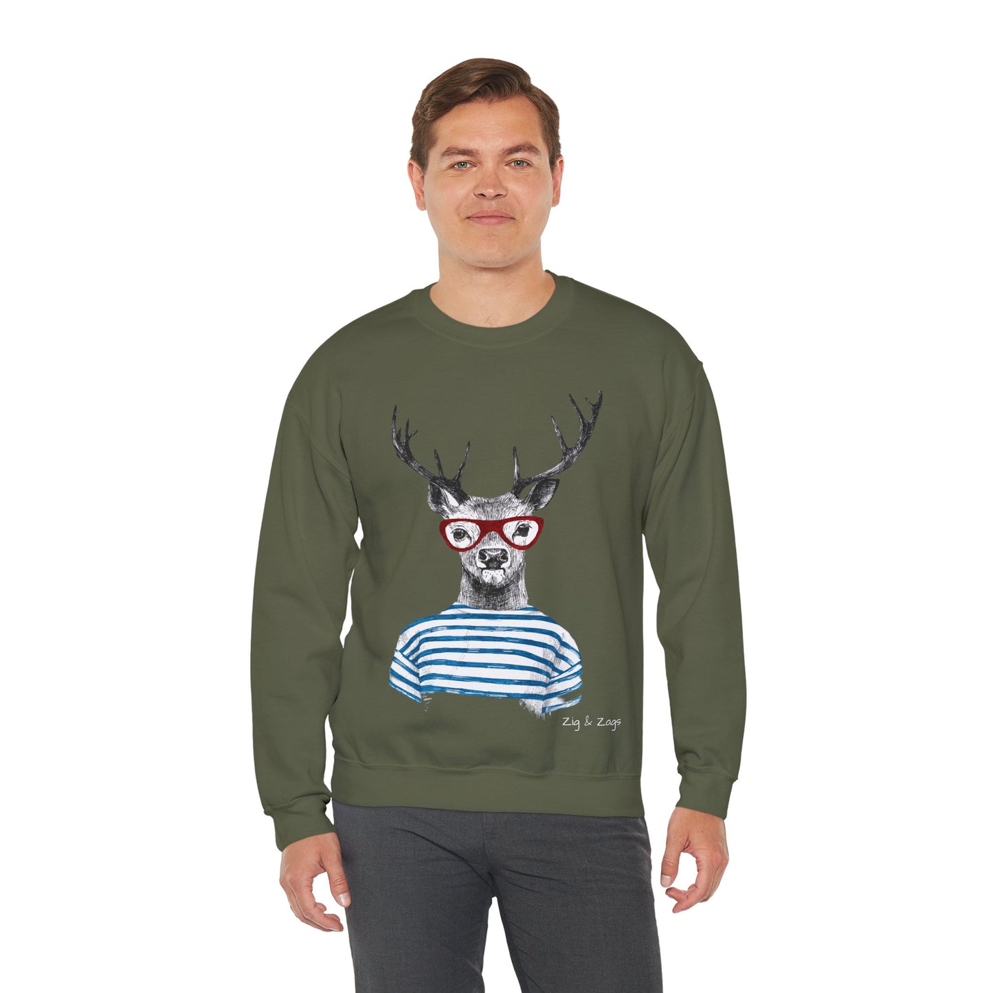 Man wearing a green sweatshirt with a graphic of a deer wearing glasses and a striped shirt on a white background.