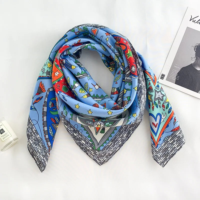 Colorful patterned scarf on a white surface with a magazine in the background